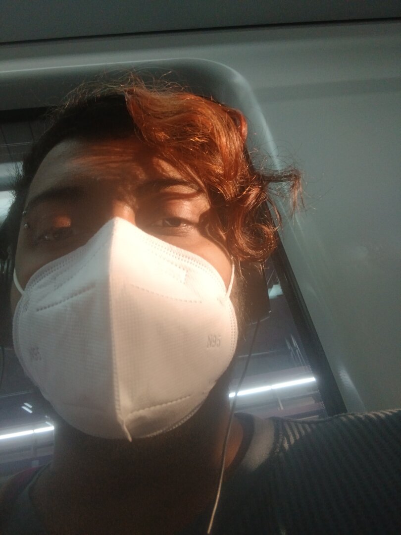 similar to the previous image, but it's zoomed int a lot more, and a single ray of sunlight is illuminating my face.